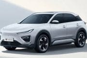 White compact SUV parked at an angle, sleek design with black-tinted windows and alloy wheels (NETA).