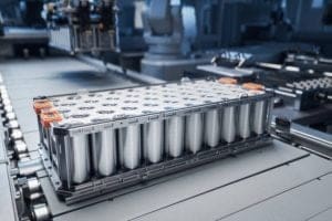 Industrial battery pack with cylindrical cells on a factory conveyor line on an assembly floor
