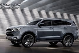Side view of a gray SUV in motion on a road, with promotional text 'The New MU-X Phantom' in the top-left corner.