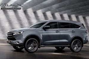 Side view of a gray SUV in motion on a road, with promotional text 'The New MU-X Phantom' in the top-left corner.