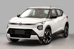 Three-quarter front view of a white crossover SUV with black trim, a wide black grille, and silver roof rails, shown indoors.